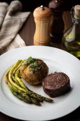 bacon wrapped tenderloin steak on white plate