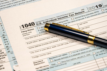 Detail closeup of current tax forms for IRS filing