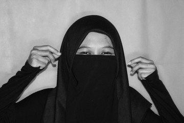 Close up view of Pretty lady woman girl wear hijab jilbab niqab kerudung niqaab scarf cover face...