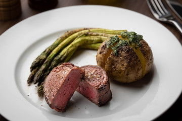 bacon wrapped tenderloin steak on white plate