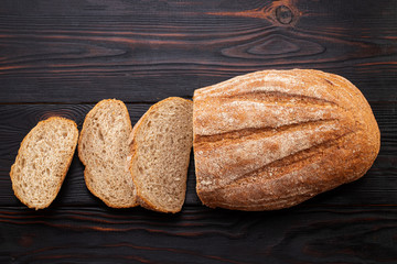 freshly baked bread on wooden table background. Top view with copy space