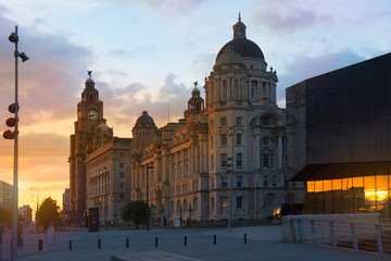 Fototapeta na wymiar Golden sunset with the Royal Liver Building and Port of Liverpool Building