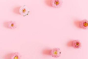 Beautiful flowers composition. Pink flowers on pastel pink background. Flat lay, top view, copy space