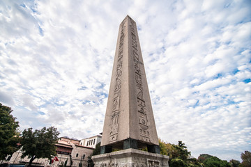 Fototapeta na wymiar Istanbul, Turkey - October, 2019 : Obelisk of Theodosius with hieroglyphs in Sultanahmet Square, Istanbul, Turkey. Ancient Egyptian obelisk in Istanbul City
