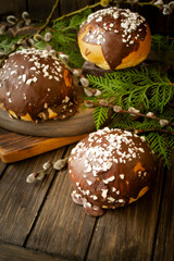 Round bun in chocolate, bread rolls. Tasty burger bread with chocolate on wooden.