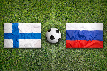 Finland vs. Russia flags on soccer field