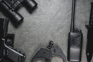 Concept of special agent accessories on dark flat lay background.