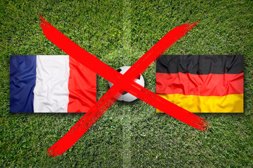 Canceled soccer game, France vs. Germany flags on soccer field