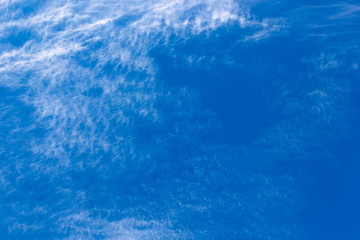 Fototapeta na wymiar plumose clouds of the top tier in blue space of the sky selective focus