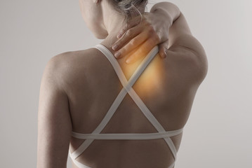 Woman with Back pain. Pure Posture Correction.