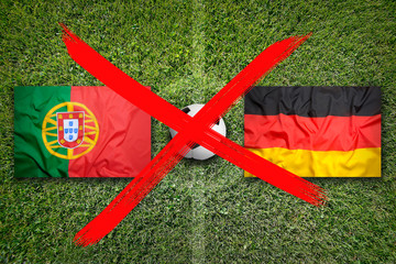 Canceled soccer game, Portugal vs. Germany flags on soccer field