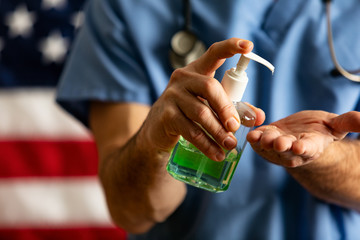 Health: Male Doctor With Pump Bottle Of Hand Sanitizer To Kill Virus