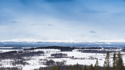 A view of the snowy hills and the island of Frösön in Sweden