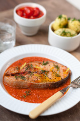 Wild Salmon Steak with Roasted Tomato Sauce Garnished with Dill and Lemon Zest