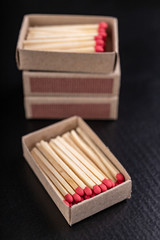 Matches in gray paper boxes. Wooden sticks with sulfur on the tip to ignite the flame.