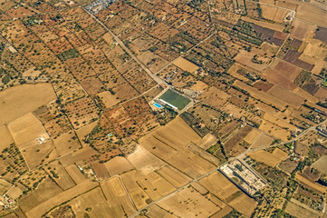 A view from airplane over Palma de Mallorca terrain during landing phase of flight to Palma International Airport at Palma de Mallorca, Spain.