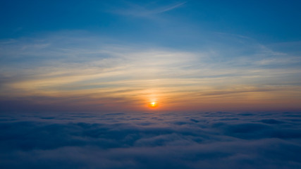 Yellow and blue dawn over clouds, concept, travel and leisure.