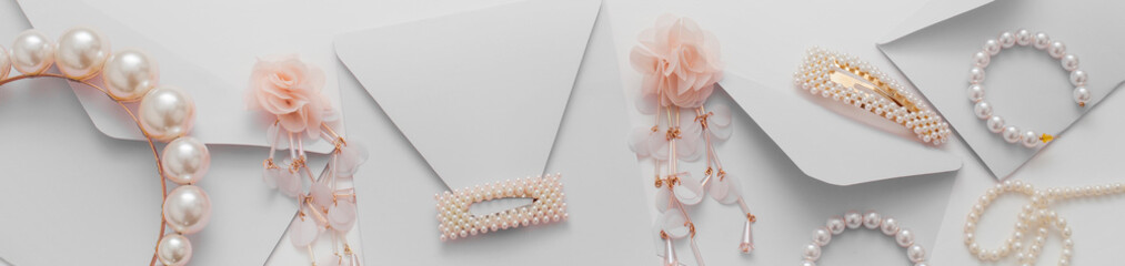 The wedding background with space for text, decorated with invitation envelopes and decorations for the bride, is made in soft pastel colors, with copy space. Conceptual backgrounds for wedding texts.