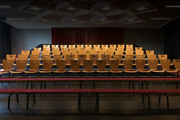 empty chairs in the auditorium of a small theatre, copy space