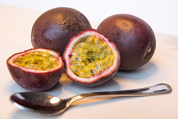 Passion fruit on white cutting board