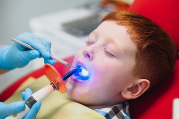 Boy satisfied with the service in the dental office. concept of pediatric dental treatment