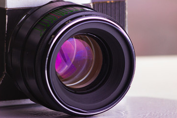 Retro old photo camera with lens