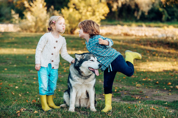 Kids Love story. Children and dog on nature background. Human emotions kids first love. Valentine day.