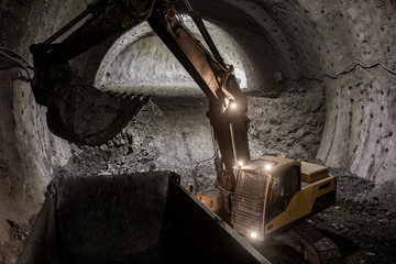 digger working in tunnel