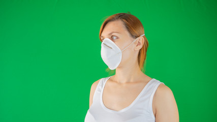 Woman in medical mask to protect her from virus, pollution, respiratory disease. Protective medical mask from coronavirus epidemic in Europe and Asia. Face Close up face with mask background photo.