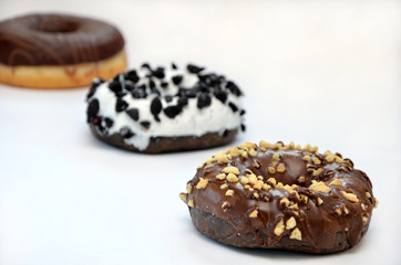 donut with chocolate and sprinkles on a white background