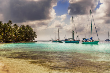 Sailboats at the bay in beautiful unspoiled Caribbean island in San Blas, Panama.