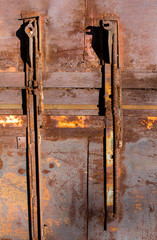 Peeling colored paint on old rusty metal. Abstract corrosion texture