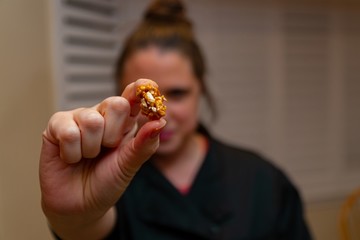 Woman Holding Caramel Popcorn