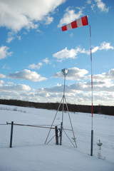 Wind indicator on sky background