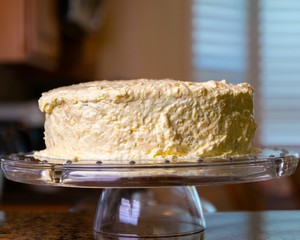 Young Woman Frosting Cake