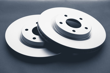 car brake discs on dark background