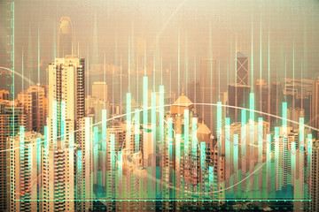 Obraz na płótnie Canvas Forex chart on cityscape with skyscrapers wallpaper double exposure. Financial research concept.