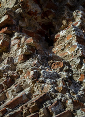 The ruins of an old brick abandoned house look like after the bombing