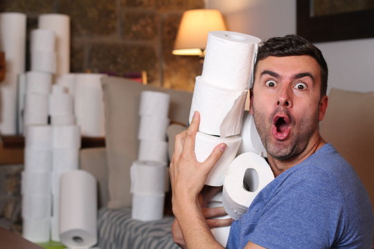 Man Stocking Up Toilet Paper At Home