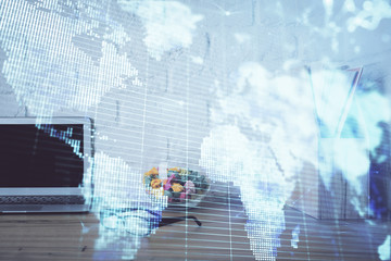 Double exposure of business theme icons and work space with computer background. Concept of success.