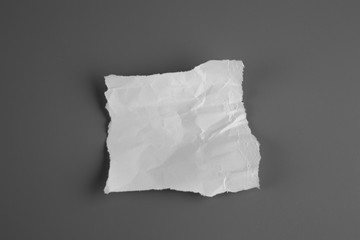 Blank portrait mock-up crumpled paper. brochure magazine isolated on gray background, changeable background / white paper isolated.