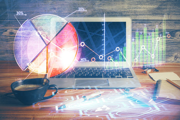 Double exposure of forex graph and work space with computer. Concept of international online trading.