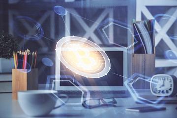 Multi exposure of blockchain and crypto economy theme hologram and table with computer background....