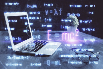 Desktop computer background and formula hologram writing. Double exposure. Education concept.