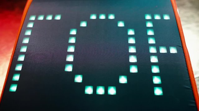 The name Victor is written on a digital screen in the office. The letters are moving. The concept of information signs.