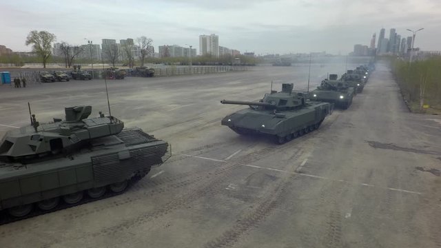 MOSCOW, RUSSIA - MAY 07, 2019: Aerial view of tanks column leaving military base to have a trial run for military parade devoted to Victory Day