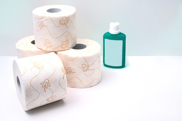 Close up of toilet paper and desinficant. Panic buying because of coronavirus.