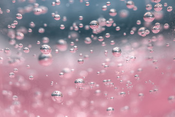 bubbles chemical liquid pink macro. chemical reaction in living organisms harmful to helium and...