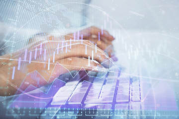 Multi exposure of graph with man typing on computer in office on background. Concept of hard work. Closeup.