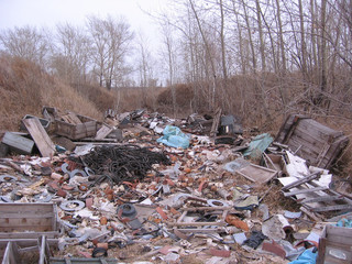 old dirty broken waste in the trash pollute the landfill